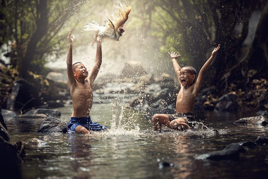 Happy children splashing water